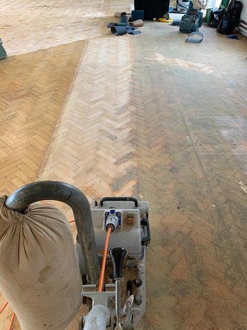 parquet floor restoration - sanding the wood